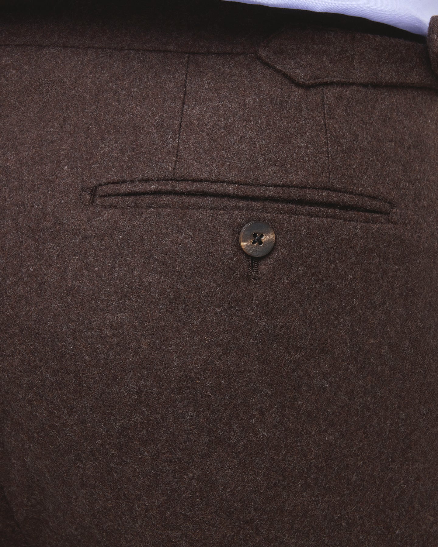 Dark brown flannel trousers with horn buttons