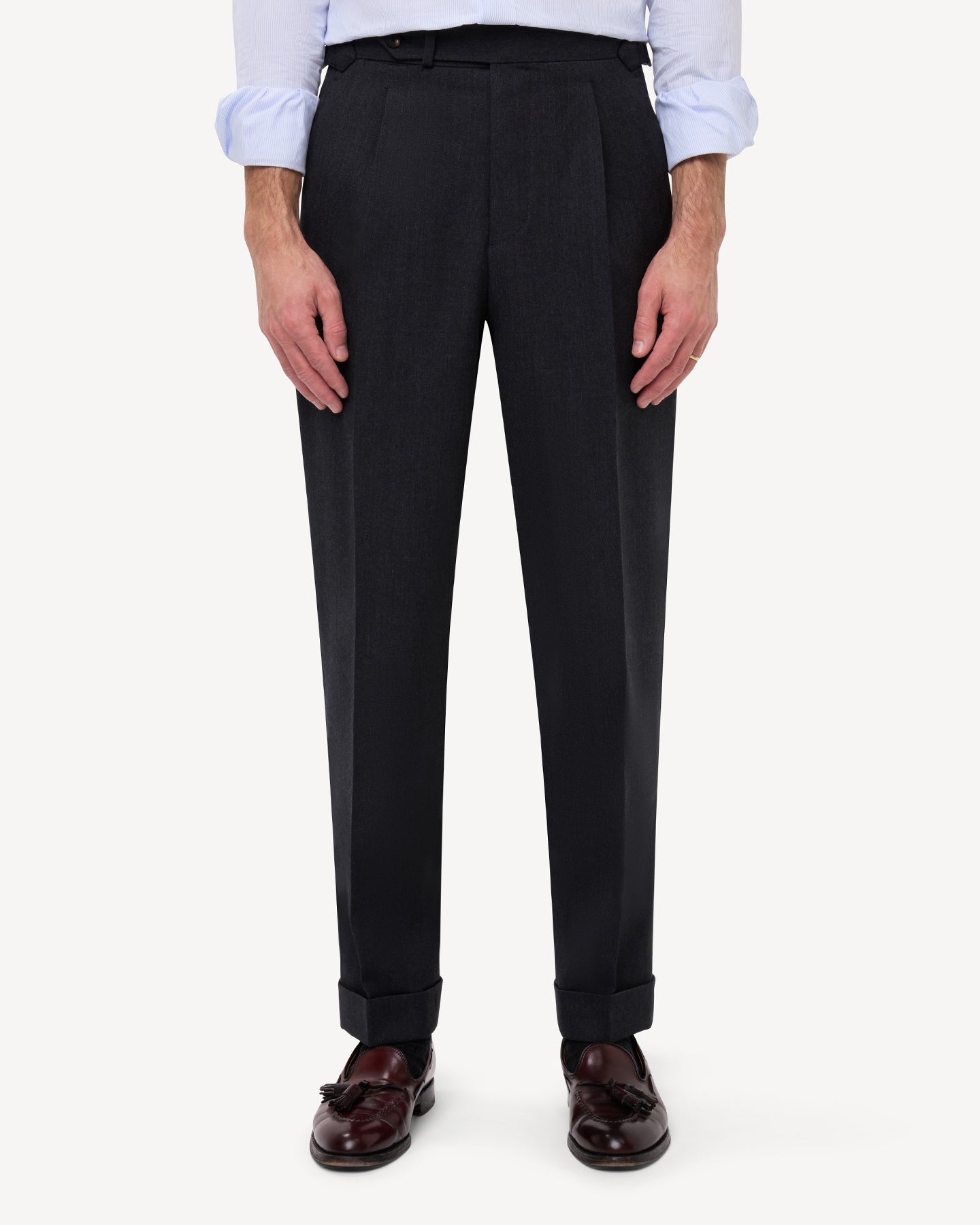 Front view of dark grey cavalry twill trousers with single pleats and side adjusters