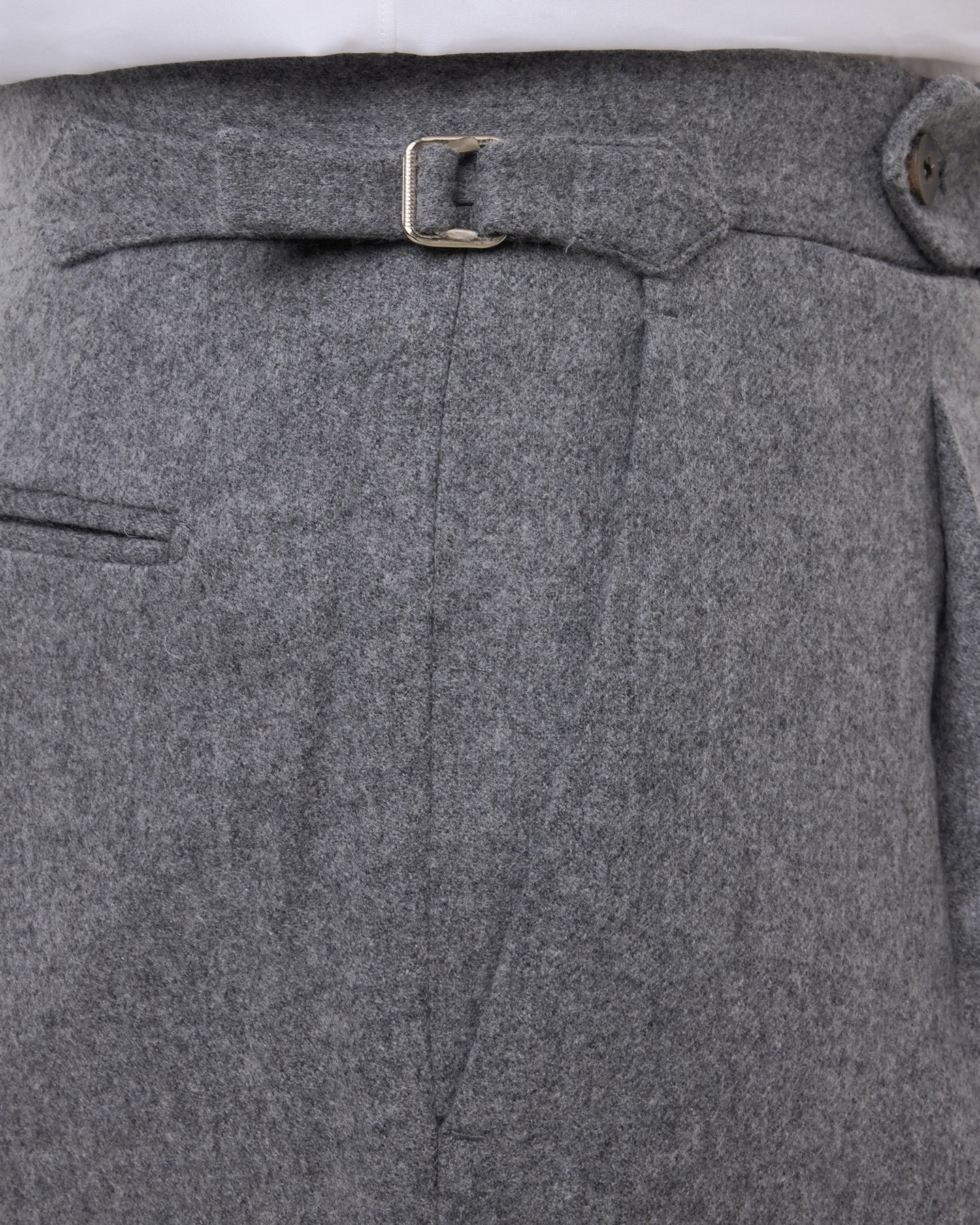 Light grey flannel trousers with side adjusters