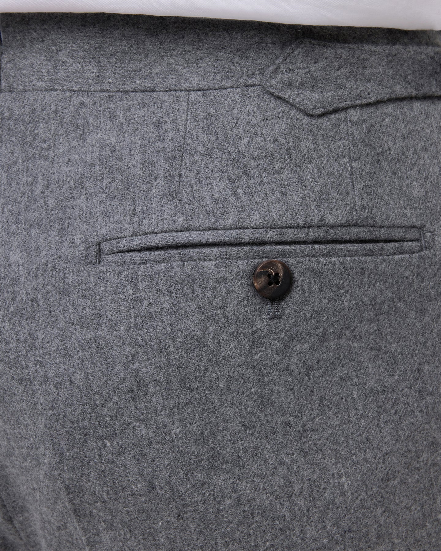 Light grey flannel trousers with horn buttons