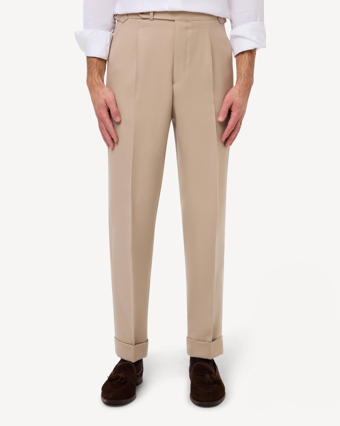 Front view of light tan cavalry twill trousers with single pleats and side adjusters