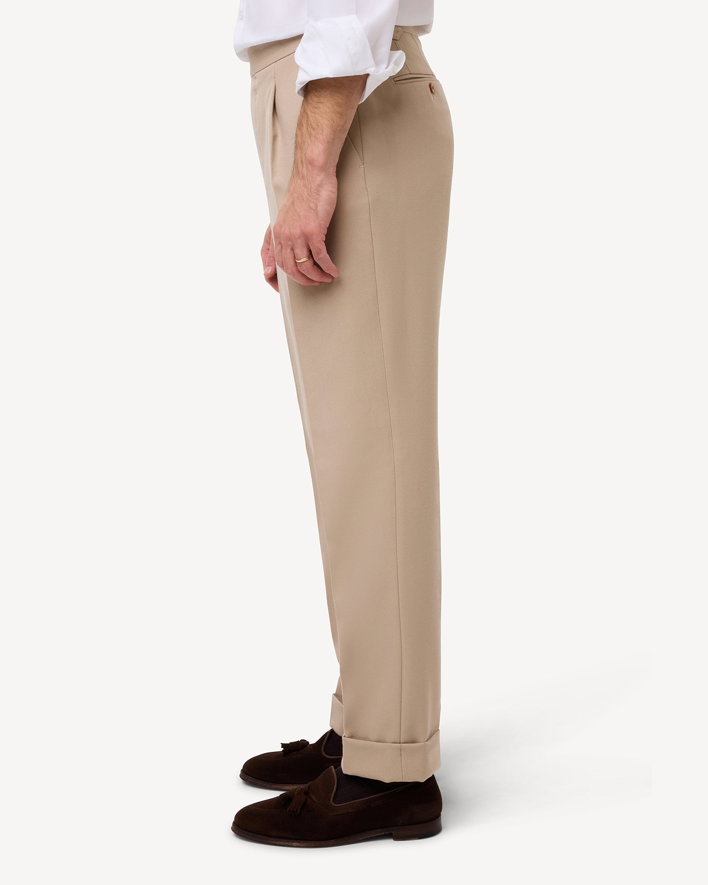 Side view of light tan cavalry twill trousers with single pleats and side adjusters