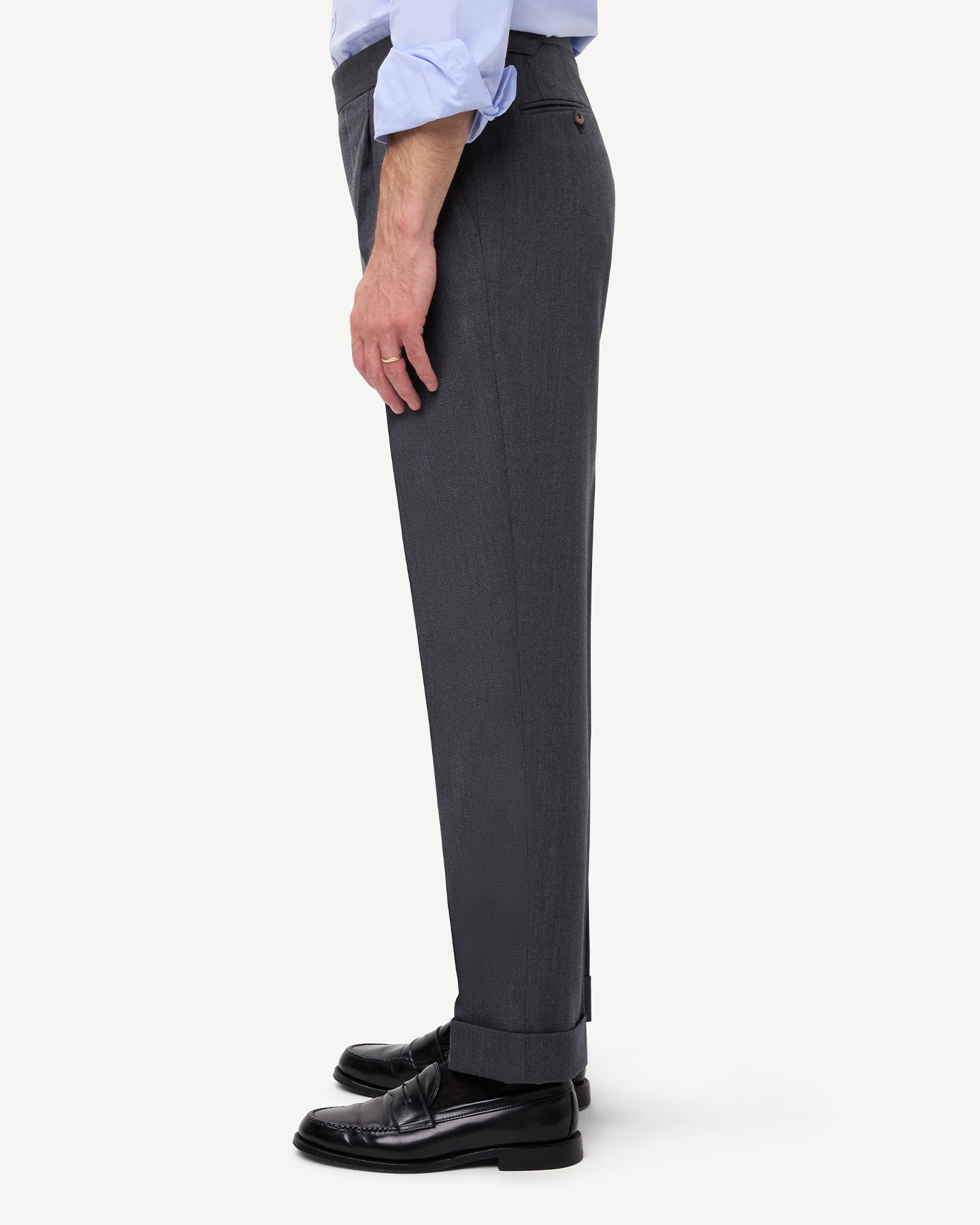 Side view of mid grey cavalry twill trousers with single pleats and side adjusters