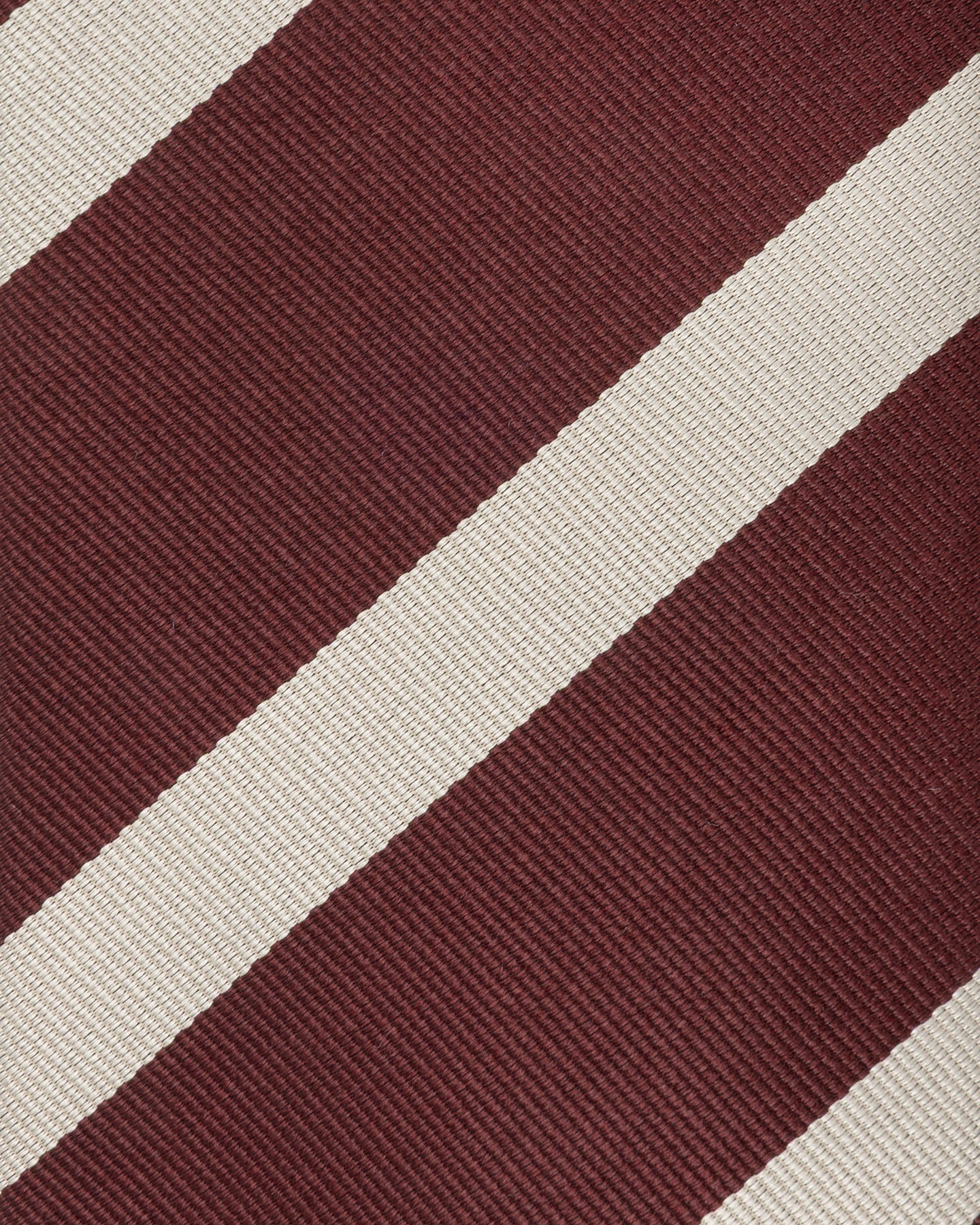 Close-up of burgundy and cream repp weave